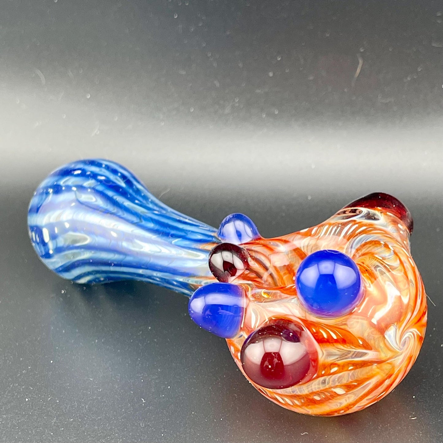 Wrap n Raked Red and Blue Silver Fumed Spoon Pipe with red and blue marbles