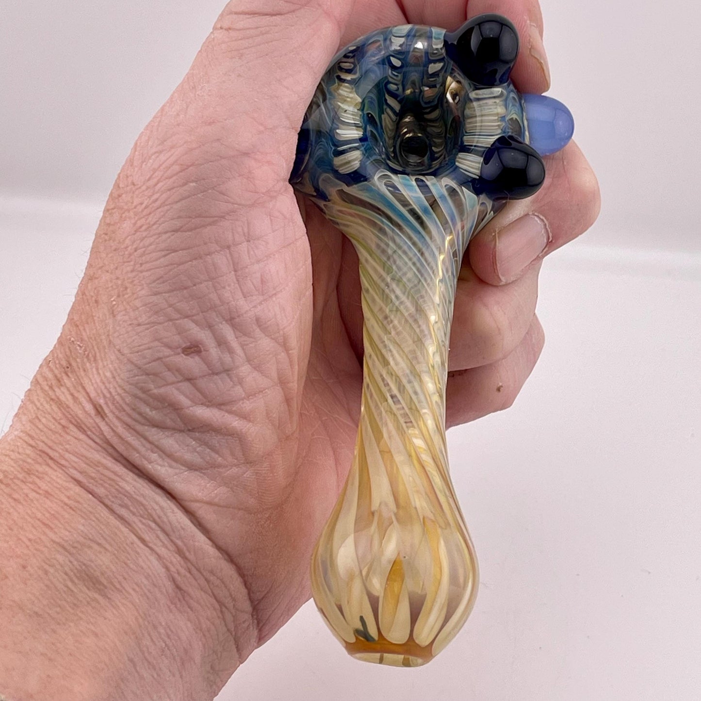 Wrap n Rake Twist Blue and Silver Fumed Spoon Pipe with light blue marbles